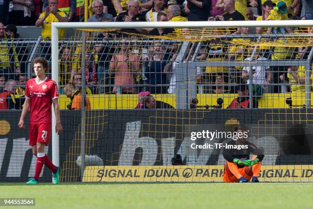 Benjamin Pavard of Stuttgart and Goalkeeper Ron-Robert Zieler of Stuttgart look dejected during the Bundesliga match between Borussia Dortmund and...