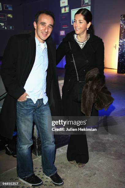 Elie Semoun and Cristiana Reali attend the Toshiba 'Go to Space' party at Palais De Tokyo on December 14, 2009 in Paris, France.