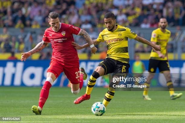 Daniel Ginczek of Stuttgart and Jeremy Toljan of Dortmund battle for the ball during the Bundesliga match between Borussia Dortmund and VfB Stuttgart...