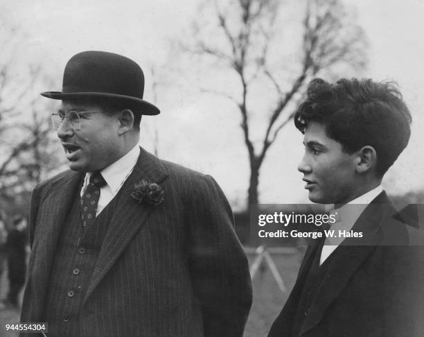 British businessman Sir Bernard Waley-Cohen and his son Stephen at the 110th Wall Game on the College Field at Eton on St Andrew's Day, UK, 30th...