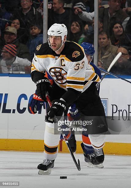 Zdeno Chara of The Boston Bruins in action against The New York Islanders during their game at the Nassau Coliseum on December 12, 2009 at the Nassau...