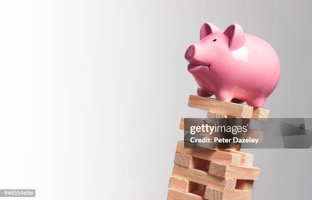 precarious finances - saving for a rainy day englische redewendung stock-fotos und bilder