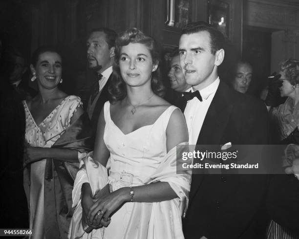 British actor George Cole and his wife Eileen Moore arrive at the Garrick Theatre in London, 7th September 1955.