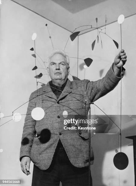American sculptor Alexander Calder at the opening of an exhibition of his mobiles at the Galleria Dell'Obelisco in Rome, Italy, 14th March 1956.