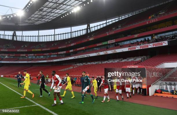 Josh Dasilva leads out the Arsenal team before the match between Arsenal U23 and Villarreal U23 at Emirates Stadium on April 10, 2018 in London,...