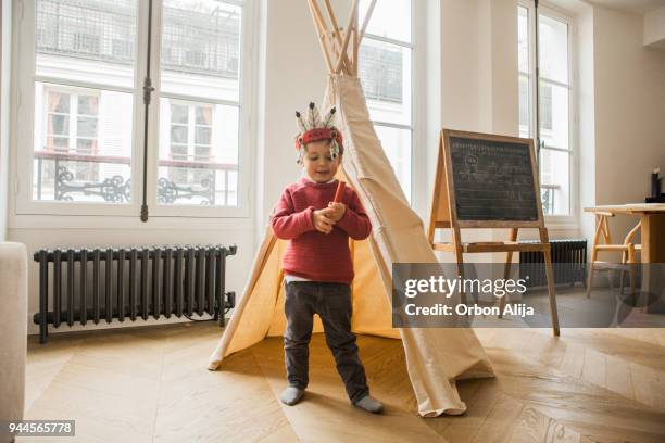 boy wearing an indian costume - teepee stock pictures, royalty-free photos & images