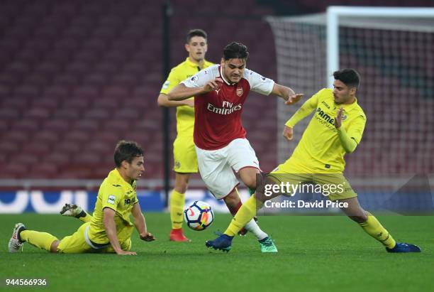 Konstantinos Mavropanos of Arsenal takes on Pedro Martinez Garcia and Sergio Lozano Lluch of Villarreal during the match between Arsenal U23 and...