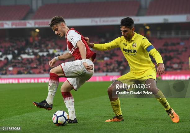 Vlad Dragomir of Arsenal is challenged by Juan Fernandez Blanco of Villarreal during the match between Arsenal U23 and Villarreal U23 at Emirates...