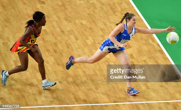 Emily Nicholl of Scotland stretches for the ball during the Netball Pool B match between Uganda and Scotland on day seven of the Gold Coast 2018...