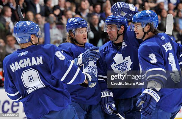 Niklas Hagman, Mikhail Grabovski, Francois Beauchemin and Garnet Exelby of the Toronto Maple Leafs celebrate a third period goal against the Ottawa...