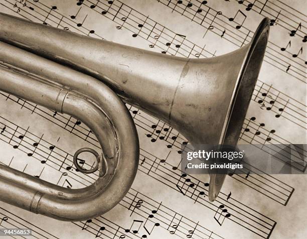 bugle horn trumpet and music - sepia - trumpet stock pictures, royalty-free photos & images