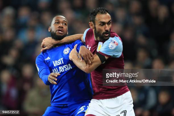 Junior Hoilett of Cardiff City tangles with Ahmed Elmohamady of Aston Villa during the Sky Bet Championship match between Aston Villa and Cardiff...