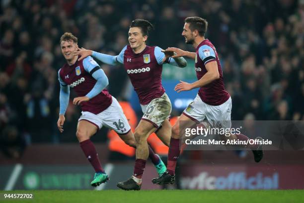 Jack Grealish celebrates his winning goal with James Bree and Conor Hourihane of Aston Villa during the Sky Bet Championship match between Aston...