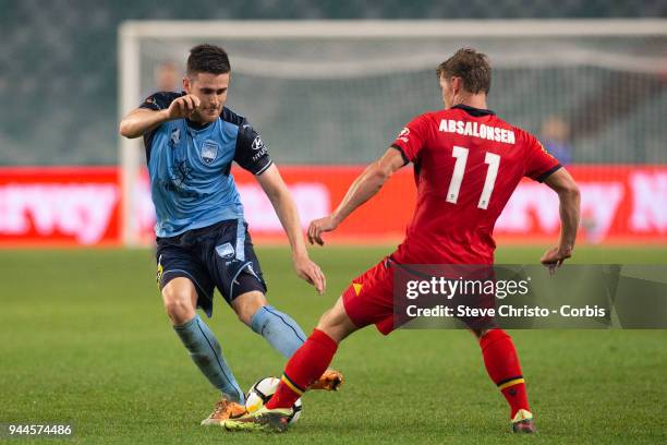 Benjamin Warland of the Sydney dribbles the ball past Adelaide's Johan Absalonsen during the round 26 A-League match between Sydney FC and Adelaide...