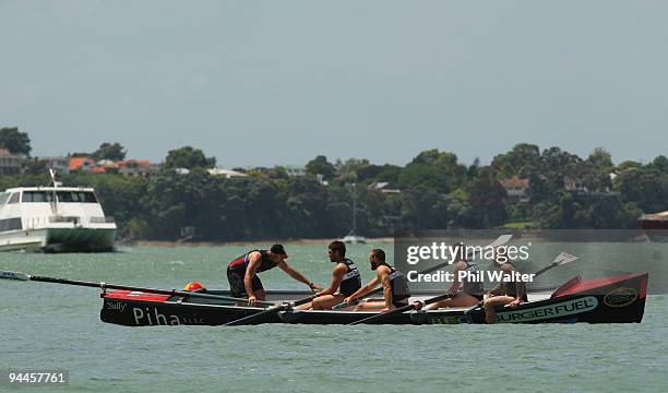 Members of the Warriors NRL team compete during the Surf Boat Duel between the Blues and the Warriors at the Viaduct Harbour on December 15, 2009 in...