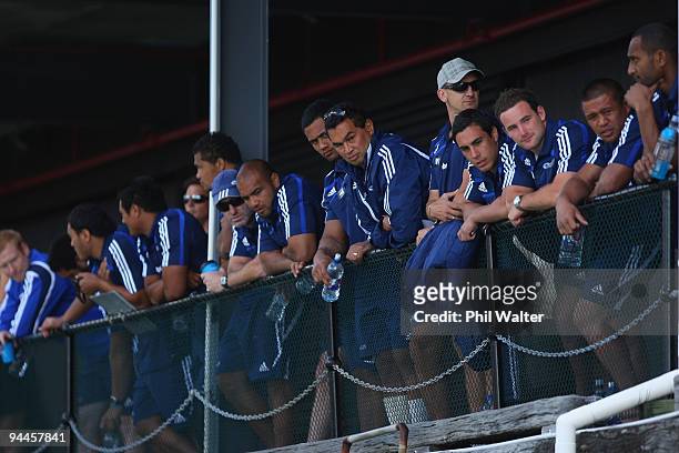Members of the Blues Super 14 team watch their team mates compete in the Surf Boat Duel between the Blues and the Warriors at the Viaduct Harbour on...