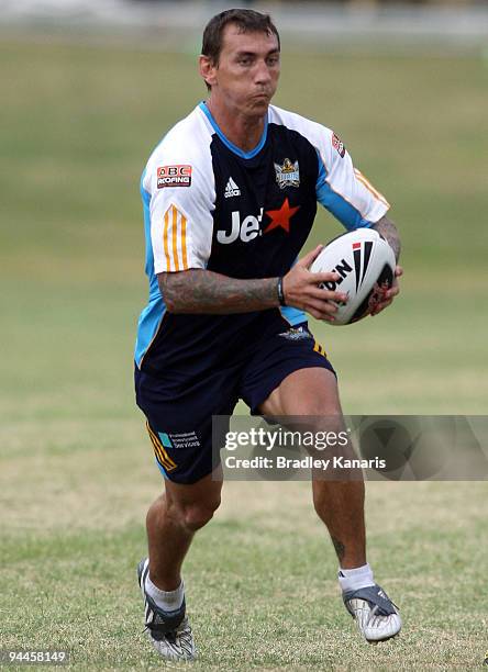 Mat Rogers runs with the ball during a Gold Coast Titans NRL training session at Robina on December 15, 2009 at the Gold Coast, Australia.