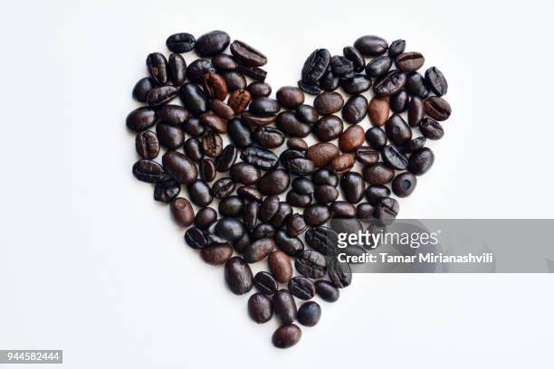 i love coffee - heart shaped coffee beans - tamar of georgia fotografías e imágenes de stock