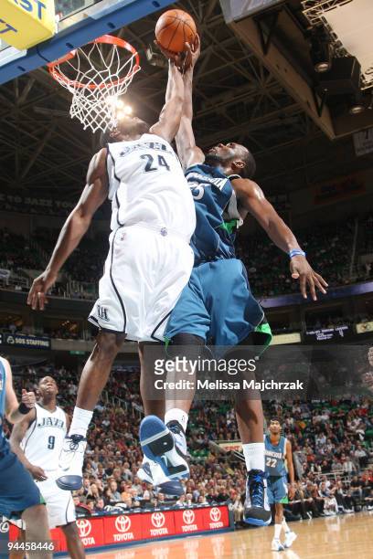 Paul Millsap of the Utah Jazz blocks the shot against Al Jefferson of the Minnesota Timberwolves at EnergySolutions Arena on December 14, 2009 in...