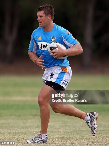 Michael Henderson runs with the ball during a Gold Coast Titans NRL training session at Robina on December 15, 2009 at the Gold Coast, Australia.