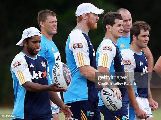 Preston Campbell, Michael Henderson, Brad Meyers, Greg Bird and Nathan Friend listen to instructions from their coach during a Gold Coast Titans NRL...