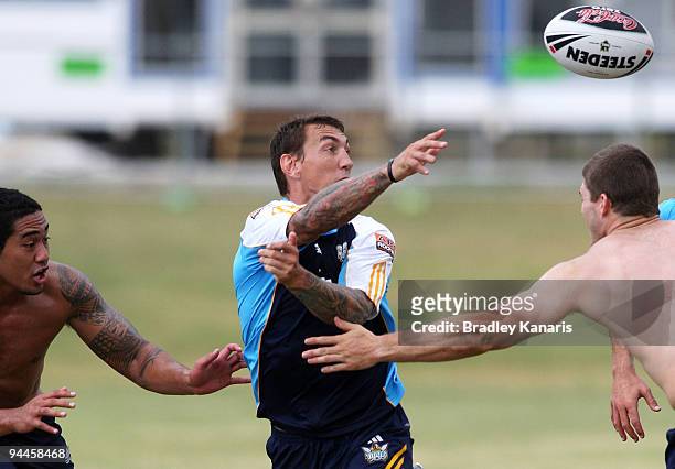 Mat Rogers passes the ball during a Gold Coast Titans NRL training session at Robina on December 15, 2009 at the Gold Coast, Australia.