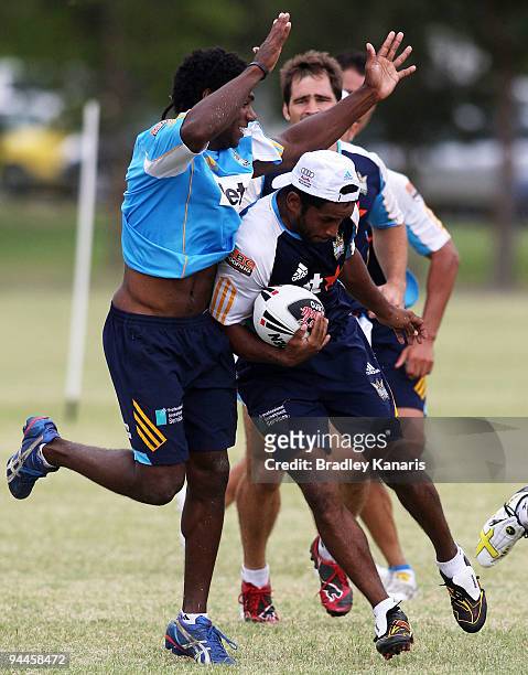 Preston Campbell takes on the defence during a Gold Coast Titans NRL training session at Robina on December 15, 2009 at the Gold Coast, Australia.