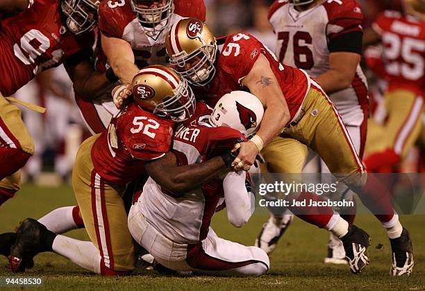 Kurt Warner of the Arizona Cardinals is sacked by Patrick Willis and Justin Smith of the San Francisco 49ers in the fourth quarter at Candlestick...