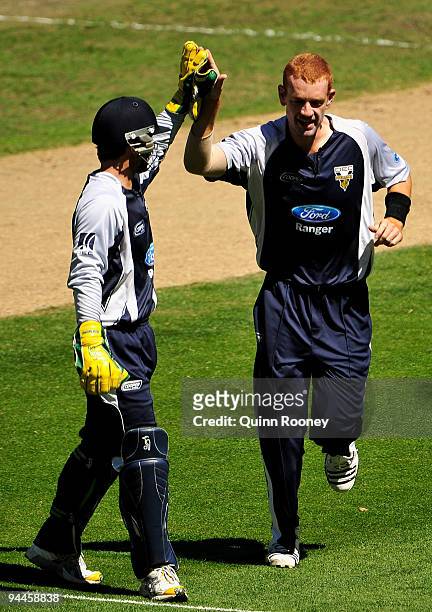 Andrew McDonald is congratulated by Matthew Wade of the Bushrangers after getting the wicket of Daniel Harris of the Redbacks during the Ford Ranger...