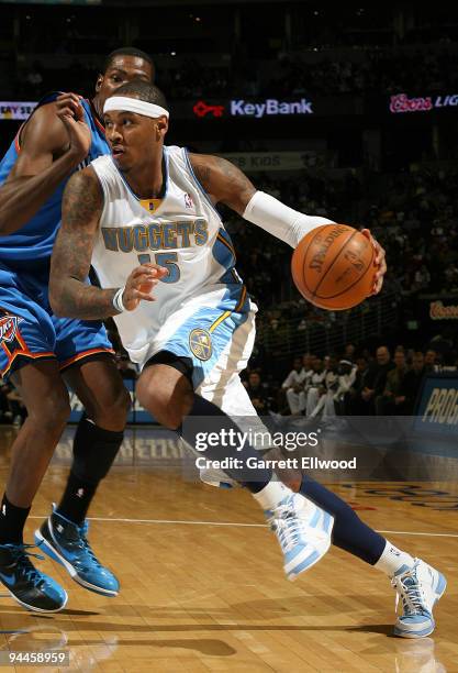 Carmelo Anthony of the Denver Nuggets goes to the basket against the Oklahoma City Thunder on December 14, 2009 at the Pepsi Center in Denver,...