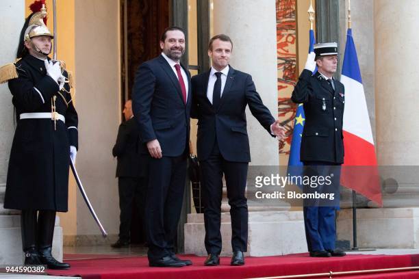 Emmanuel Macron, France's president, second right, and Saad al-Hariri, Lebanon's prime minister, second left pose for photographers at the Elysee...