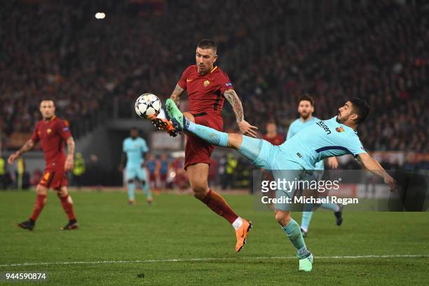 Aleksandar Kolarov of AS Roma is challenged by Luis Suarez of Barcelona UEFA Champions League Quarter Final Second Leg match between AS Roma and FC...