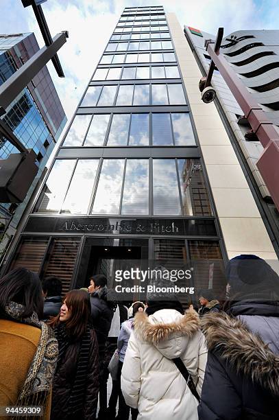 Customers wait in line for the opening of the first Abercrombie & Fitch Co. Shop in Tokyo, Japan, on Tuesday, Dec. 15, 2009. Abercrombie & Fitch Co....