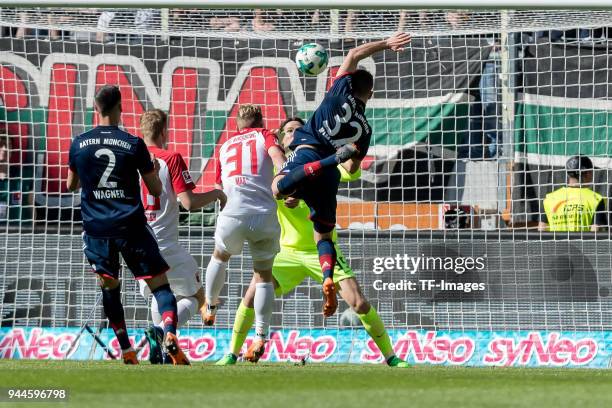 Philipp Max of Augsburg Goalkeeper Marwin Hitz of Augsburg and Joshua Kimmich of Muenchen battle for the ball during the Bundesliga match between FC...