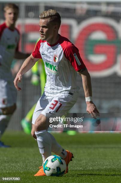 Philipp Max of Augsburg controls the ball during the Bundesliga match between FC Augsburg and FC Bayern Muenchen at WWK-Arena on April 7, 2018 in...