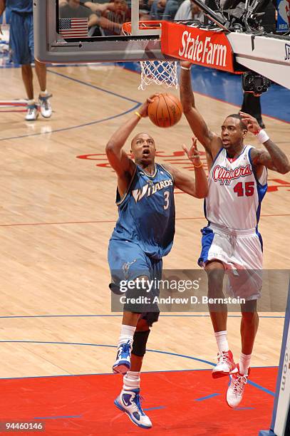 Caron Butler of the Washington Wizards goes up for a shot against Rasual Butler of the Los Angeles Clippers at Staples Center on December 14, 2009 in...