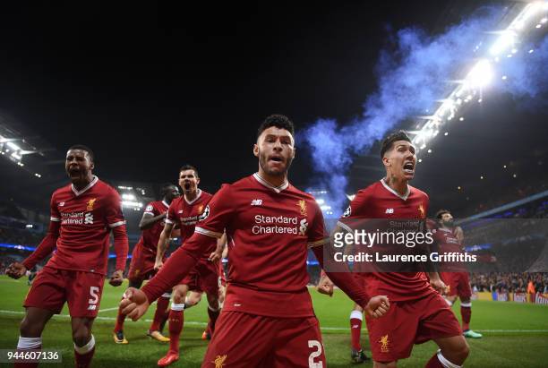 Alex Oxlade-Chamberlain and Roberto Firmino of Liverpool celebrate their sides first goal scored by Mohamed Salah during the Quarter Final Second Leg...