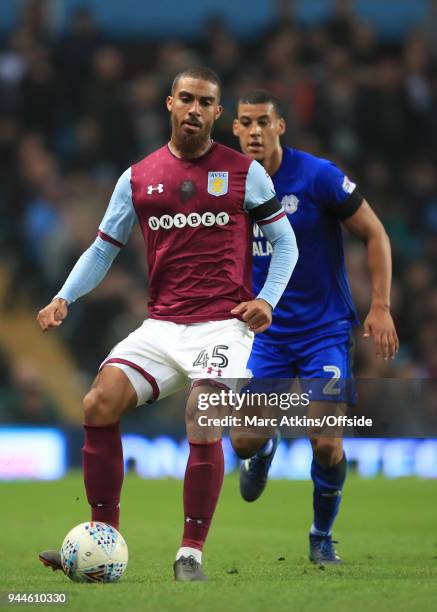 Lewis Grabban of Aston Villa in action with Lee Peltier of Cardiff City during the Sky Bet Championship match between Aston Villa and Cardiff City at...