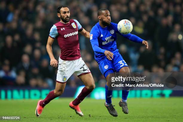 Junior Hoilett of Cardiff City in action with Ahmed Elmohamady of Aston Villa during the Sky Bet Championship match between Aston Villa and Cardiff...