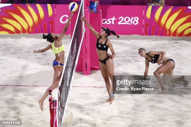 Melissa Humana-Paredes of Canada blocks a shot from Manolina Konstantinou of Cyprus during the Beach Volleyball Women's Semi Final match between...