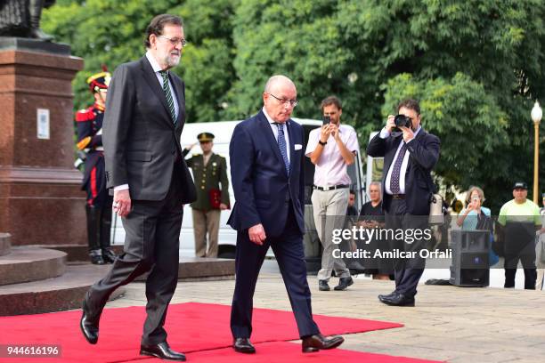 Prime Minister of Spain Mariano Rajoy walks with the Argentine Minister of Foreign Affairs Jorge Faurie after the floral offering to the Jose de San...