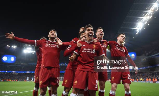 Roberto Firmino of Liverpool celebrates scoring the second goal with Alex Oxlade-Chamberlain, Virgil Van Dijk, James Milner and Andy Roberton during...