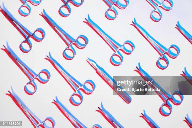 forceps and a scalpel in pattern - bjarte rettedal stock pictures, royalty-free photos & images