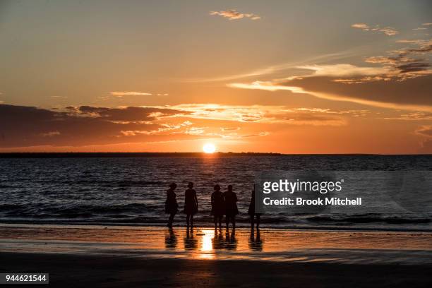 People enjoy the sunset on Mindil Beach on April 8, 2018 in Darwin, Australia. Darwin is the capital of the Northern Territory. It is the smallest...