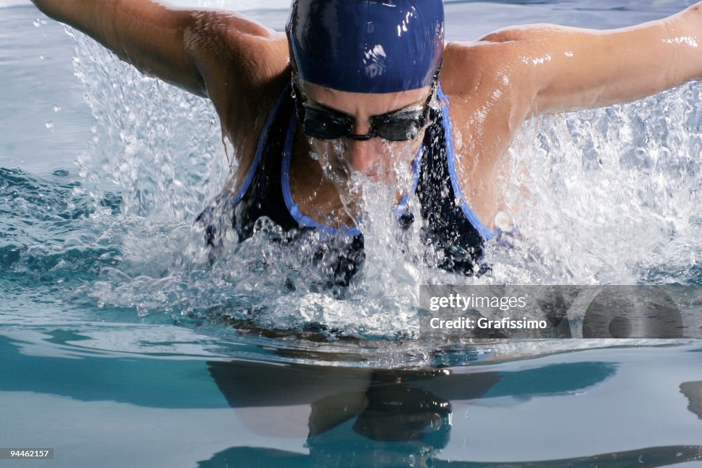 Athlete swimming butterfly