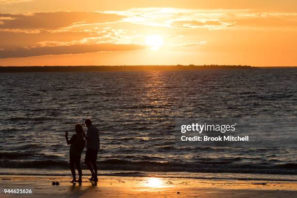 People enjoy the sunset on Mindil Beach on April 8, 2018 in Darwin, Australia. Darwin is the capital of the Northern Territory. It is the smallest...