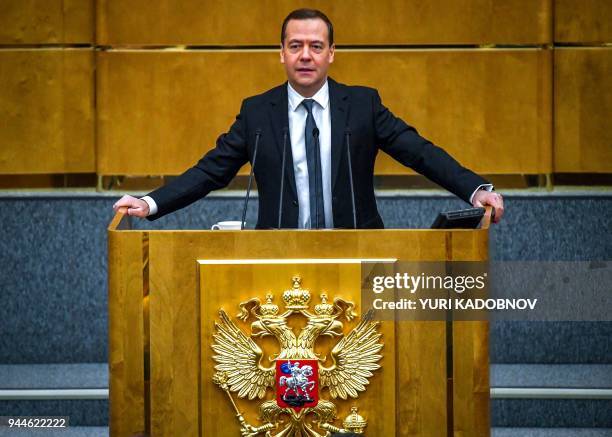 Russia's Prime Minister Dmitry Medvedev delivers a speech at the lower house of Russian parliament, the State Duma in Moscow on April 11, 2018.