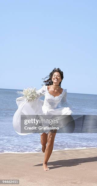 bride running at the beach - bride running stock pictures, royalty-free photos & images