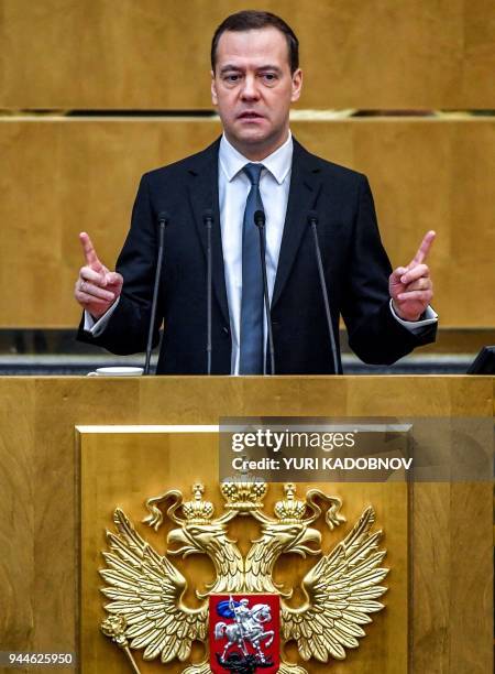 Russia's Prime Minister Dmitry Medvedev delivers a speech at the lower house of Russian parliament, the State Duma in Moscow on April 11, 2018.