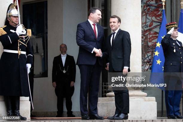 French President Emmanuel Macron welcomes Lettonia President Raimonds Vejonis at Elysee Palace on April 9, 2018 in Paris, France. The President...